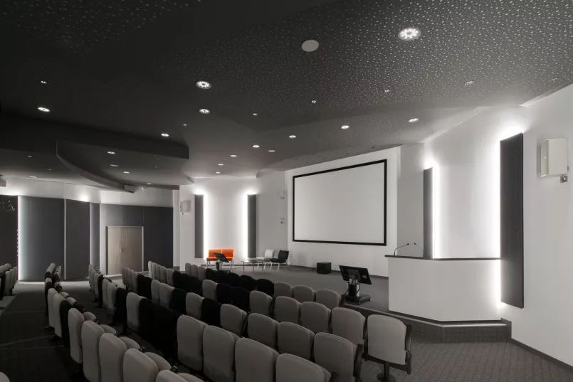 Stylishly decorated auditorium at Orange Toulouse with modern ETAP lighting.