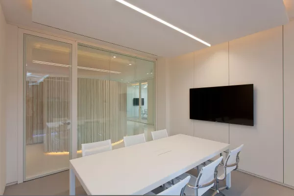 Office spaces fitted with daylight sensors and LED luminaires, depicting energy conservation and optimal brightness
