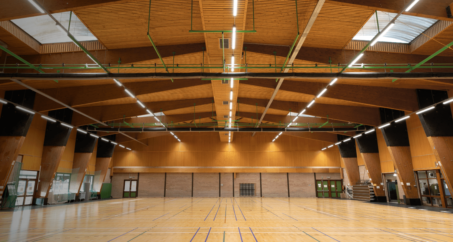 Sportshall brightly illuminated by high-efficiency Etap Lighting systems, ensuring optimal visibility and safety
